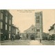 03 GANNAT. Façade Eglise Sainte-Croix et commerces 1905