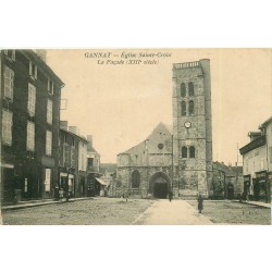 03 GANNAT. Façade Eglise Sainte-Croix et commerces 1905