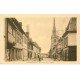 carte postale ancienne 27 CONCHES. Rue Sainte Foy Eglise et Pâtisserie