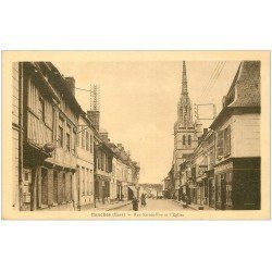 carte postale ancienne 27 CONCHES. Rue Sainte Foy Eglise et Pâtisserie