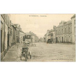 carte postale ancienne 27 LE VAUDREUIL. Motocyclette tricycle sur Grande Rue 1906