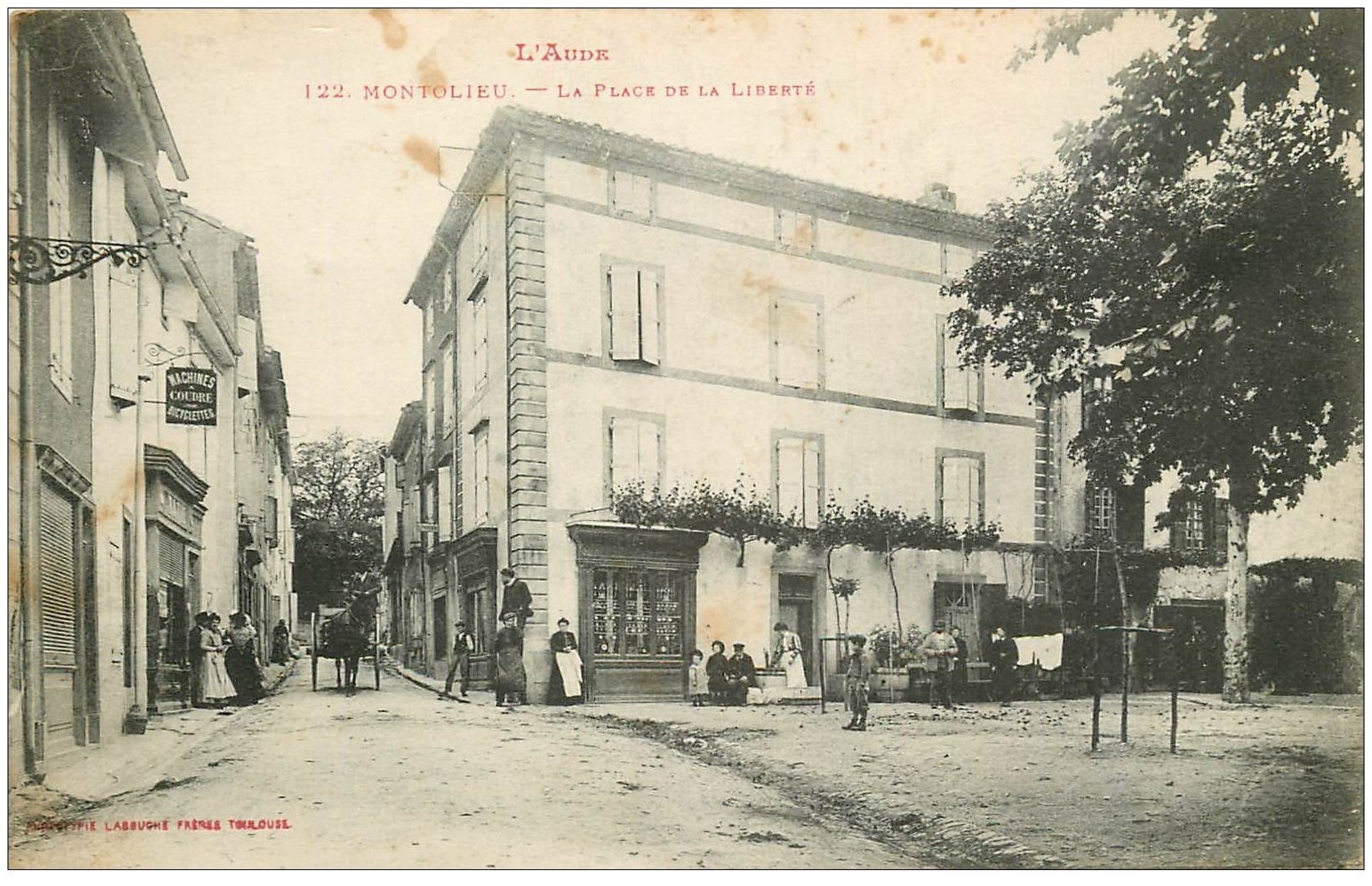 11 MONTOLIEU. Place de la Liberté 1916. Magasin Machines à coudre et Bicyclettes