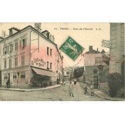 carte postale ancienne 78 TRIEL. Rue de l'Hautil Café de la Mairie et Grande Rue de Triel. Le rosé est dû au verso...