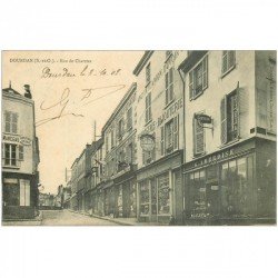 carte postale ancienne 91 DOURDAN. Rue de Chartres 1908 Coiffeur Bijouterie Horlogerie Confections et Articles de chasse