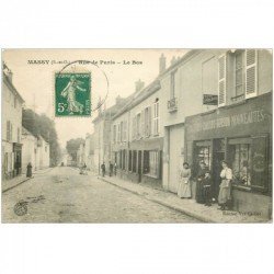 carte postale ancienne 91 MASSY. Le Bas Rue de Paris Epicerie Journaux 1910