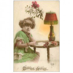 carte postale ancienne ENFANTS. Fillette rédigeant une lettre de Bonne année. Collection Rex