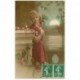 carte postale ancienne SUPERBE FEMME. Avec des Roses et fond de décor bucolique. Destinataire à La Canourgue