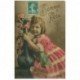 carte postale ancienne BONNE FETE. Fillette et Roses en vase 1909