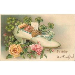 03 MONTEIGNET. Un Bonjour avec bijoux dans un soulier. Carte gaufrée 1908