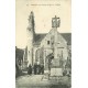 22 LANLOUP. Femme sortant de l'Eglise 1908 avec Calvaire