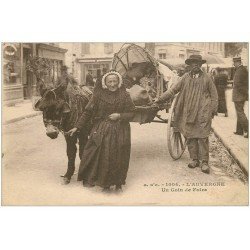 63 OLLIERGUES. Un Coin de Foire. Vendeuse Paysanne attelage Ane