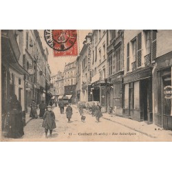 91 CORBEIL. Tailleur, Modes, Boucherie et Coiffeur Rue Saint-Spire bien animée 1908