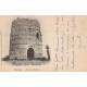27 TOURNY. Ancien Moulin à vent avec personnage sur le mur 1902